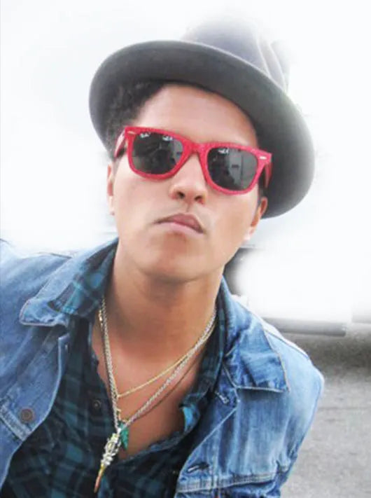 Bruno Mars wearing a Bullets 4 Peace pendant