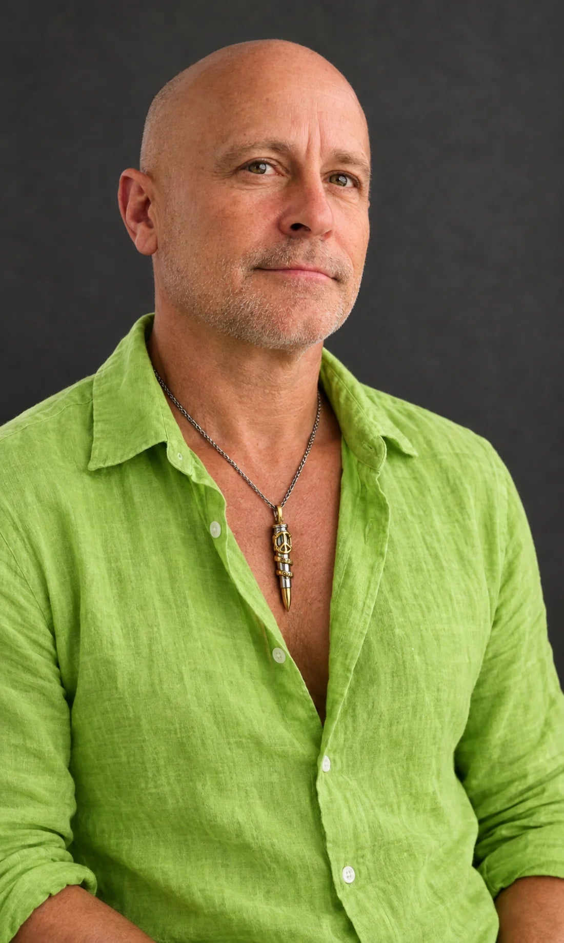 Rafi Anteby wearing a Bullets 4 Peace pendant